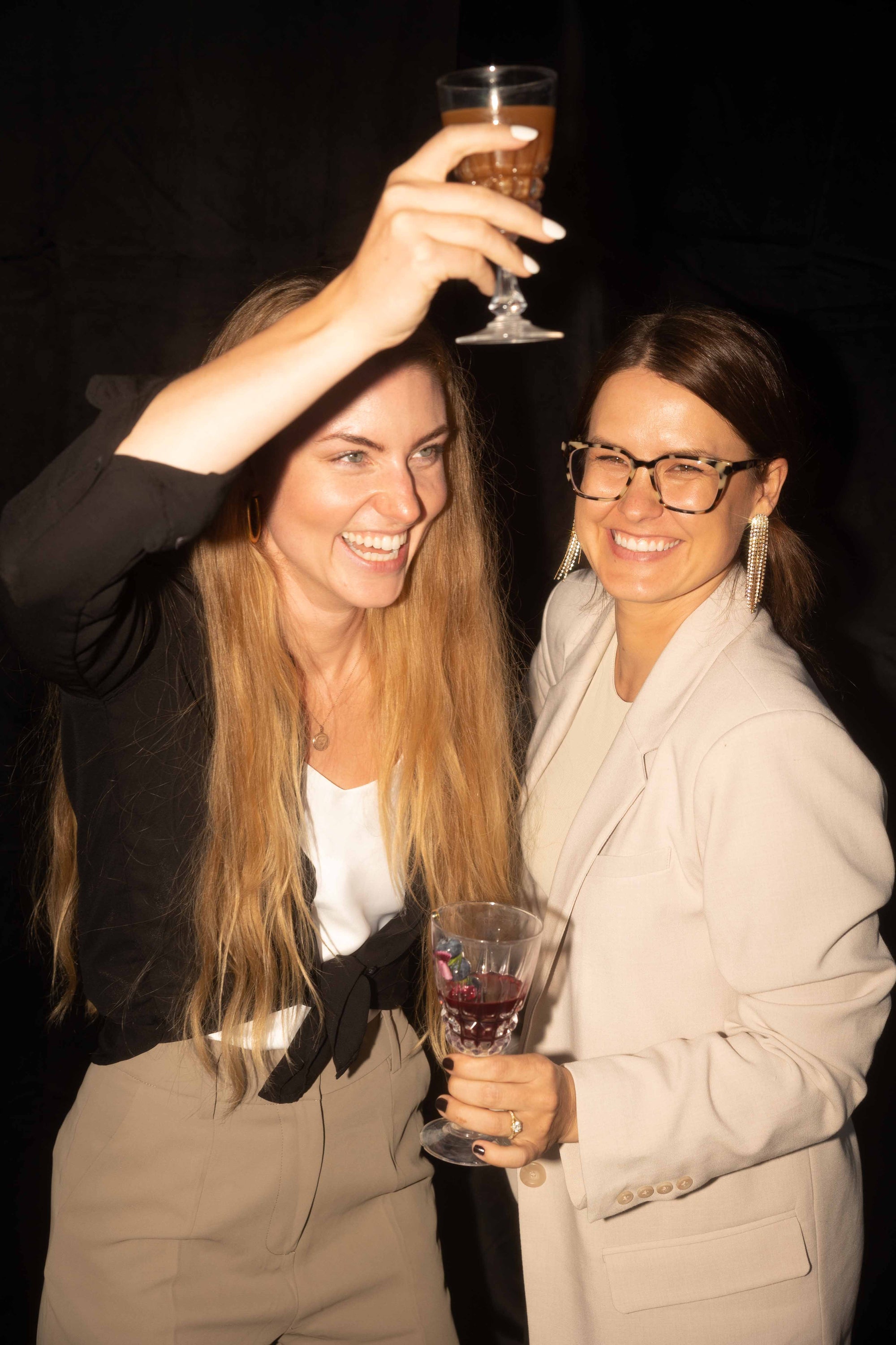 Vanessa and Mariah at party with non alcoholic drinks our story image